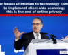 Male speaker at a white podium delivering a talk on a blue background with 'London Tech Week' signage visible to the left.