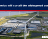 Headline: 'Economics will curtail the widespread use of AI' over an aerial view of a wind farm and an industrial complex beneath a dark blue banner with a red stripe.