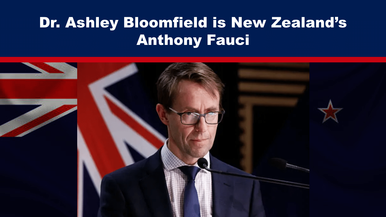 Top banner proclaims 'Dr. Ashley Bloomfield is New Zealand’s Anthony Fauci' as a man in a suit speaks at a podium with microphones and a New Zealand flag behind him