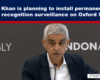 News banner above a man at a microphone; headline about permanent facial recognition surveillance on Oxford Street.